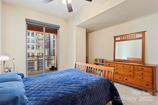 a bedroom with a bed and a dresser in it