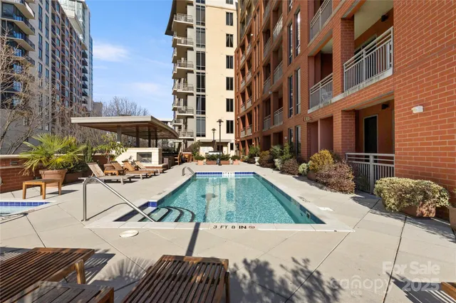 a view of a swimming pool with a lounge chairs