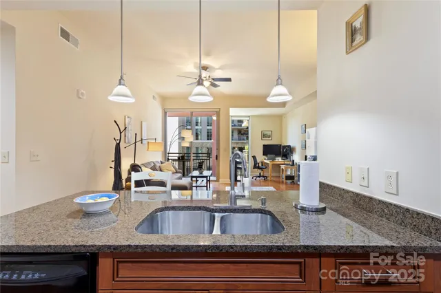 a view of a living room and kitchen view
