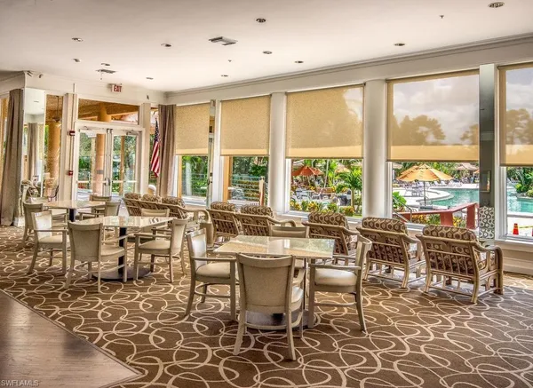 a large dining space with furniture window and outside view