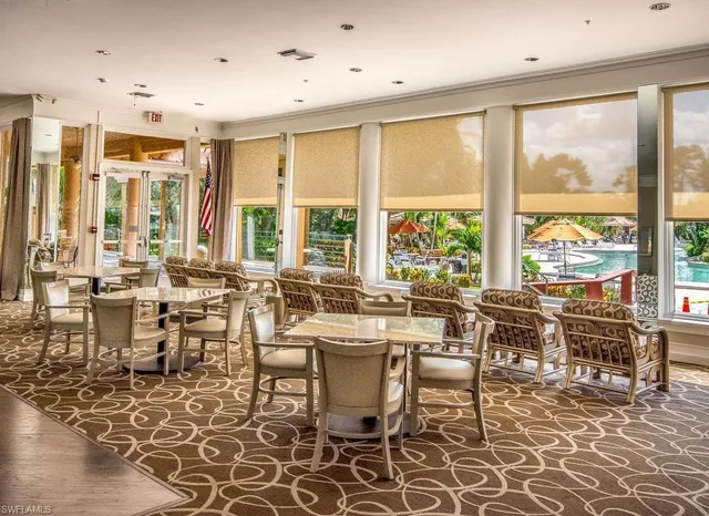 a large dining space with furniture window and outside view