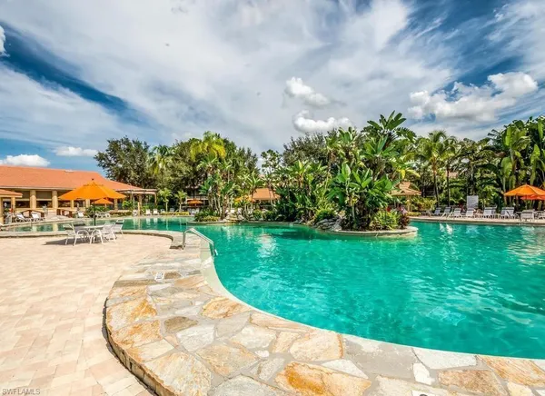 a view of a swimming pool and a yard