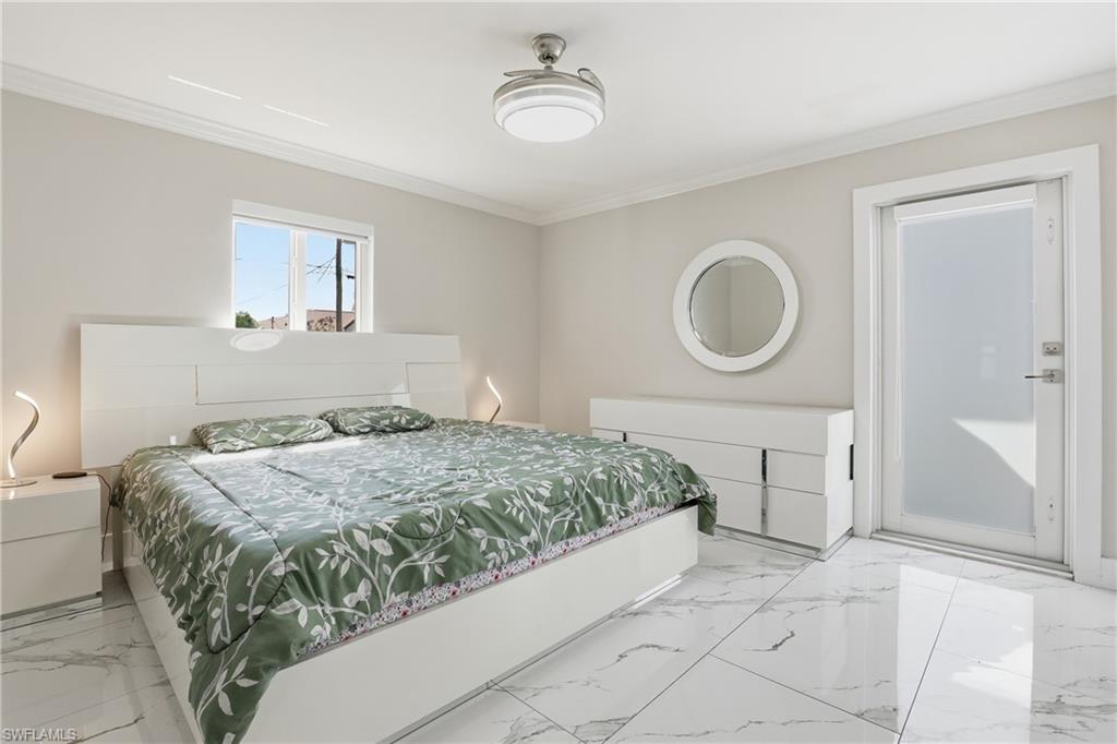5312 17th Avenue Southwest Naples, FL 34116 - Photo 16 of 45 Bedroom with crown molding and marble finish floors