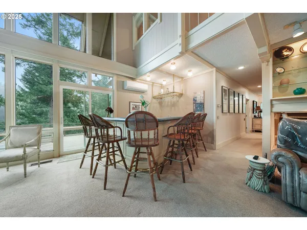 a view of a dining room with furniture window and outside view