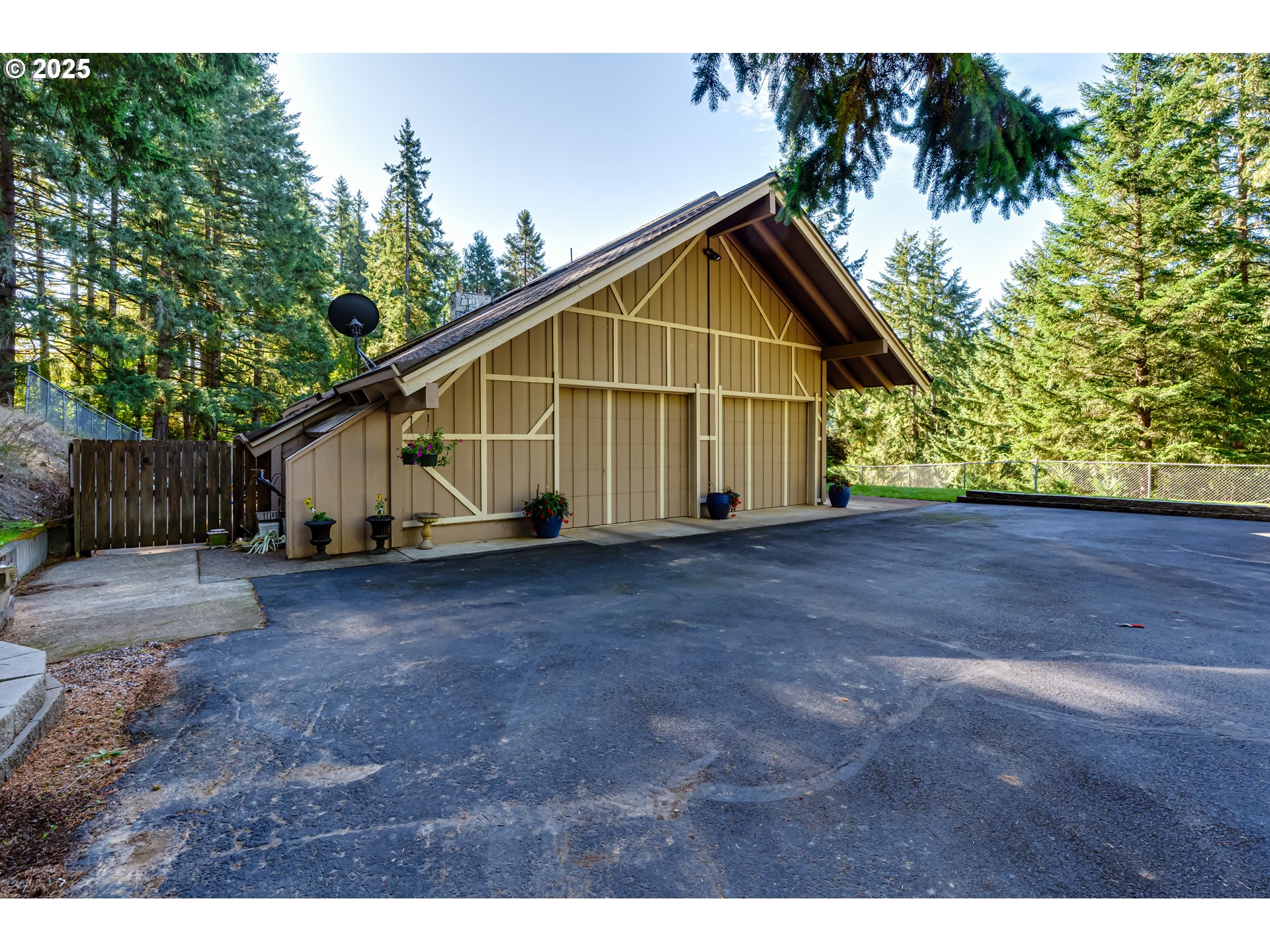 27415 Siuslaw Road Lorane, OR 97451 - Photo 2 of 48 a view of front house with wooden fence