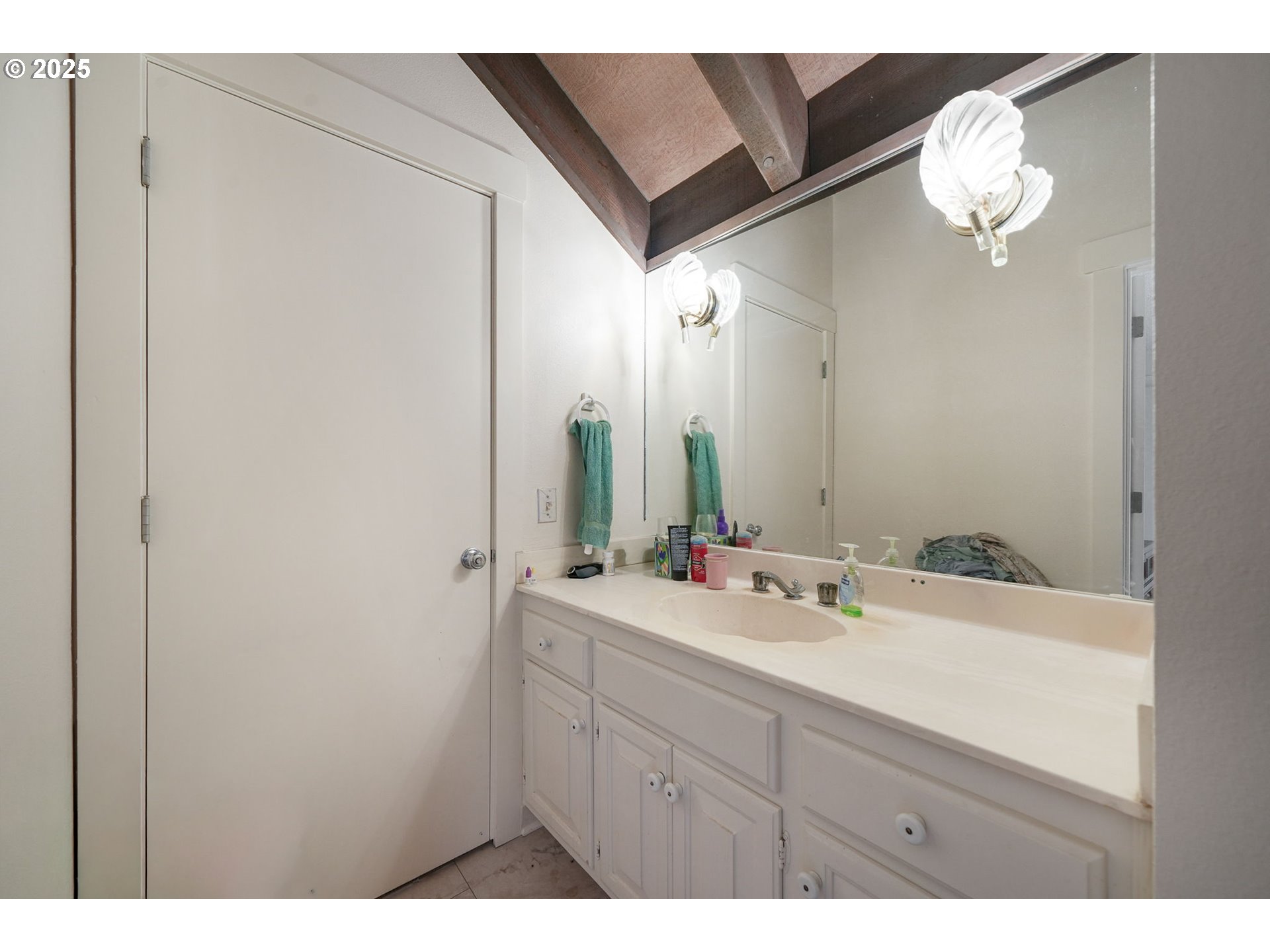 27415 Siuslaw Road Lorane, OR 97451 - Photo 27 of 48 a bathroom with a sink and a mirror