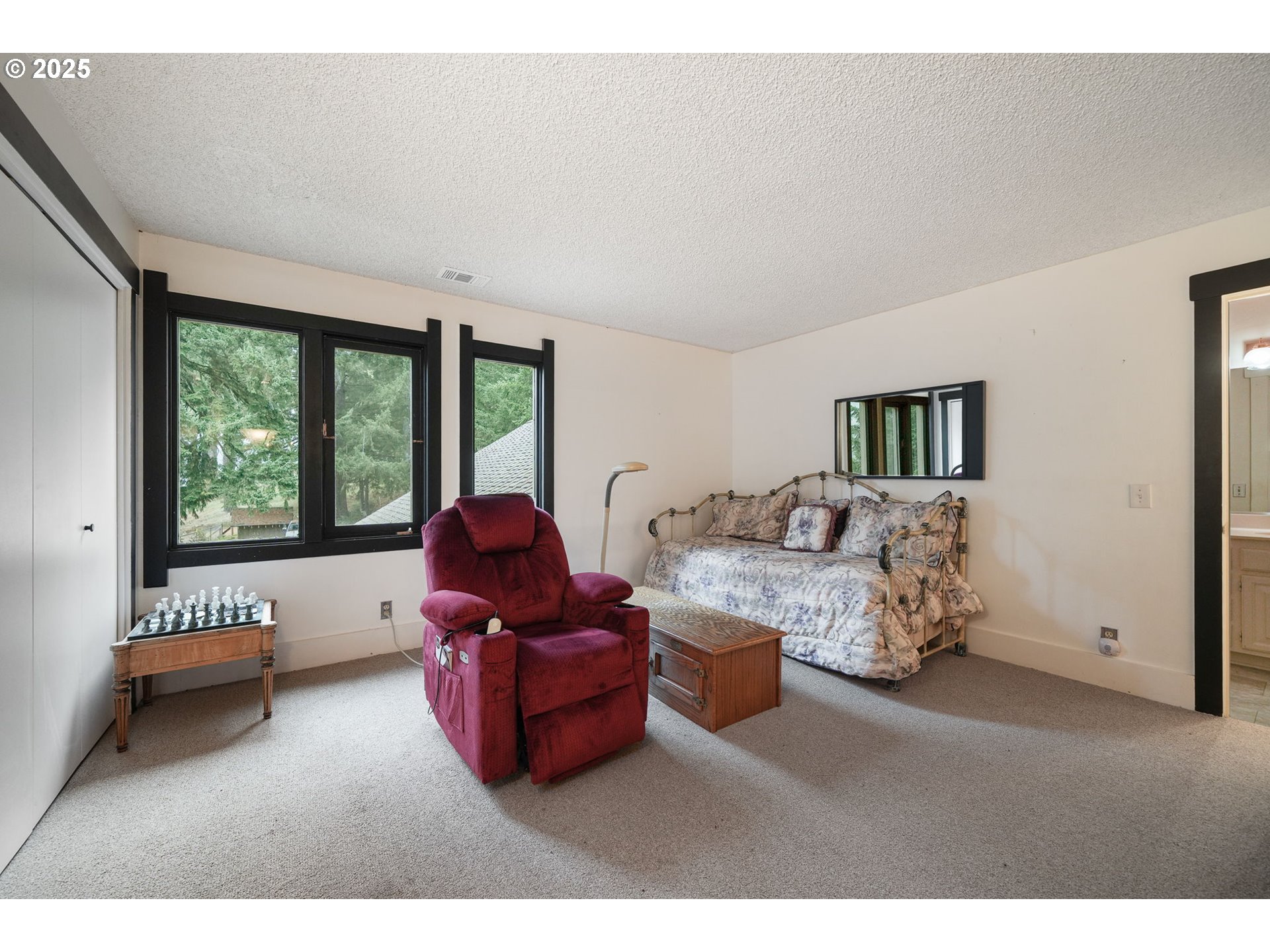 27415 Siuslaw Road Lorane, OR 97451 - Photo 29 of 48 a living room with furniture and a large window
