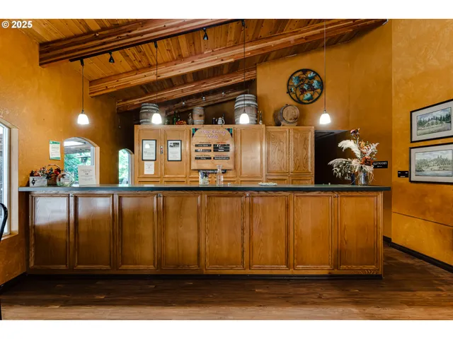 a view of a patio with table and chairs with wooden floor and fence