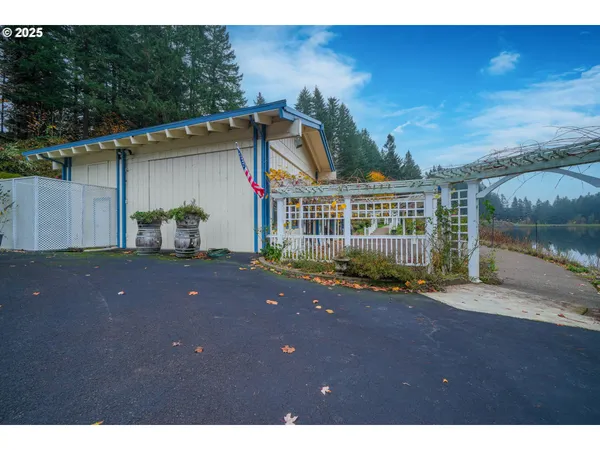 a view of house with backyard and garden