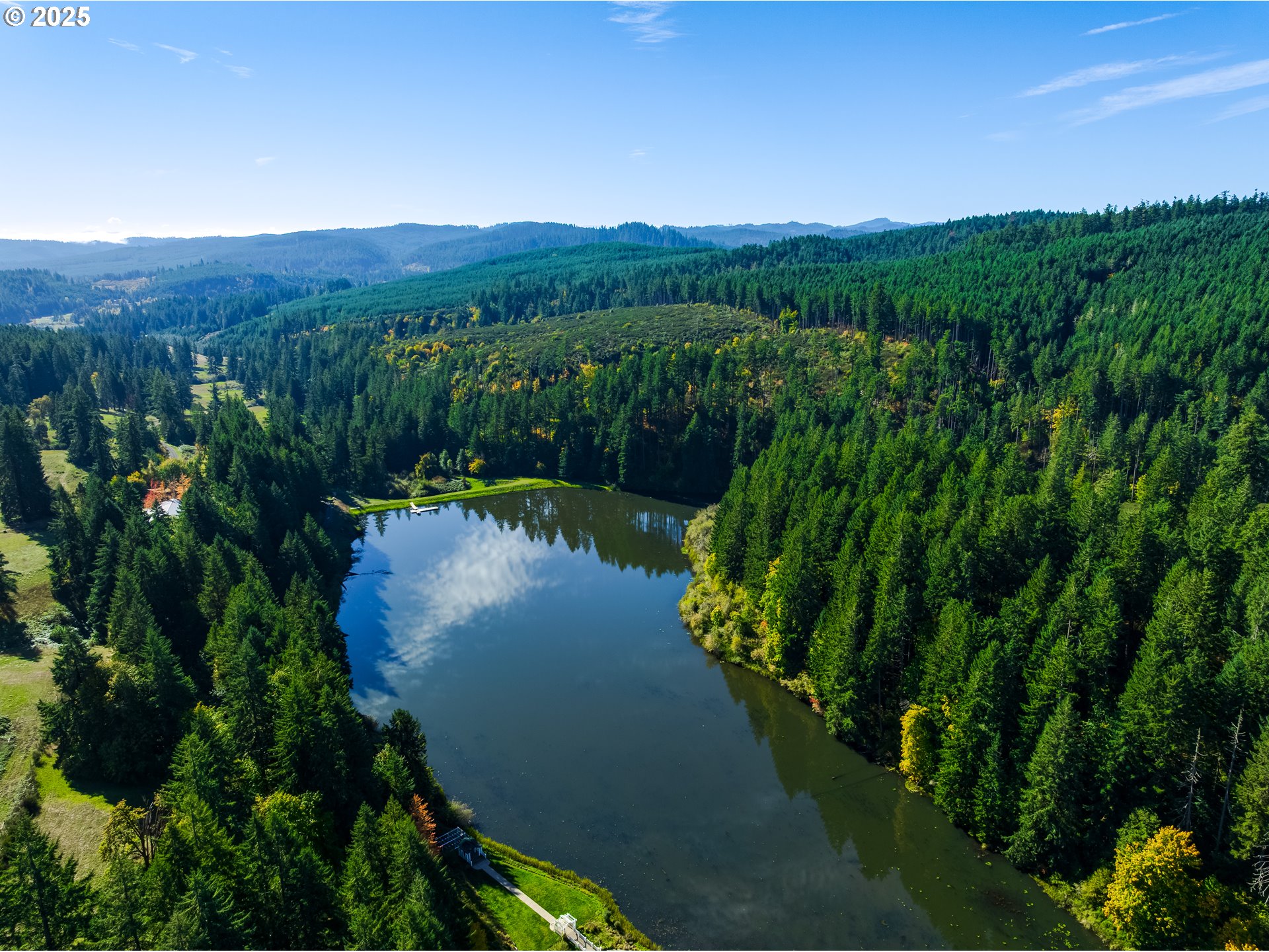 27415 Siuslaw Road Lorane, OR 97451 - Photo 47 of 48 a view of a lake with a mountain in the background