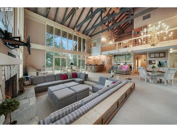 a living room with furniture fireplace and a flat screen tv
