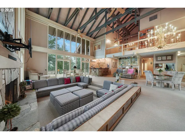 a living room with furniture fireplace and a flat screen tv