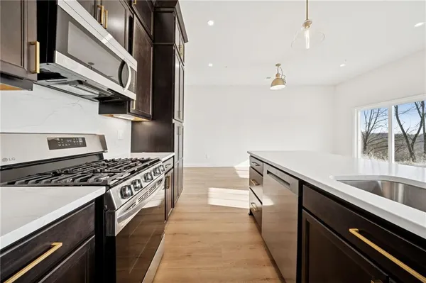 a kitchen with a stove and a sink