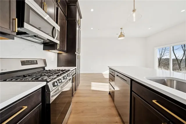 a kitchen with a stove and a sink