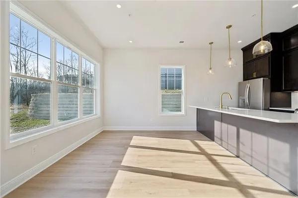 a view of a kitchen with a sink and a window