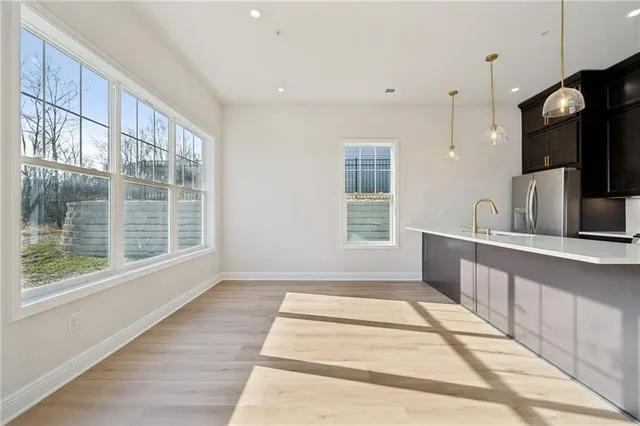 a view of a kitchen with a sink and a window