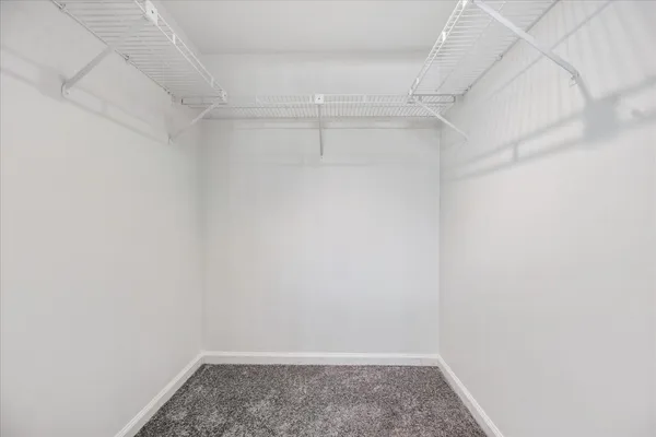 a bathroom with a granite countertop sink mirror and shower