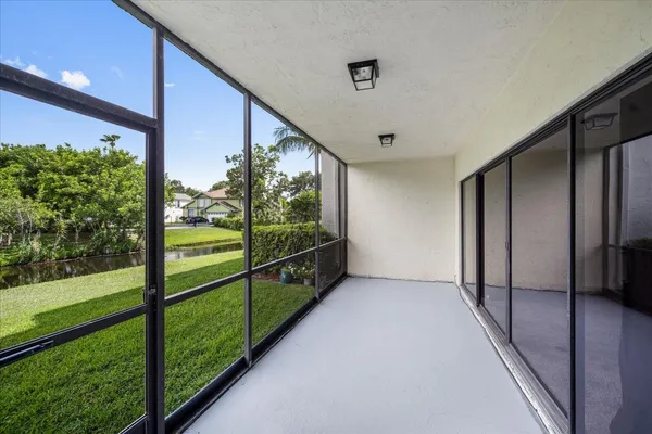 a view of room that has a white walls