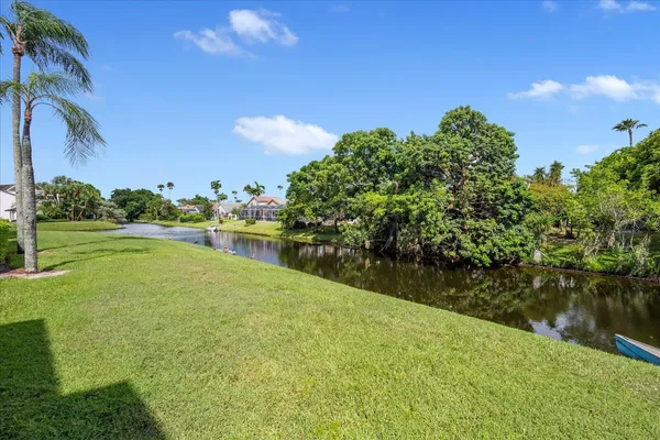 a view of a garden with a building in the background