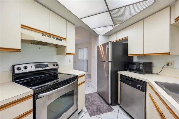 a kitchen with a stove microwave and refrigerator