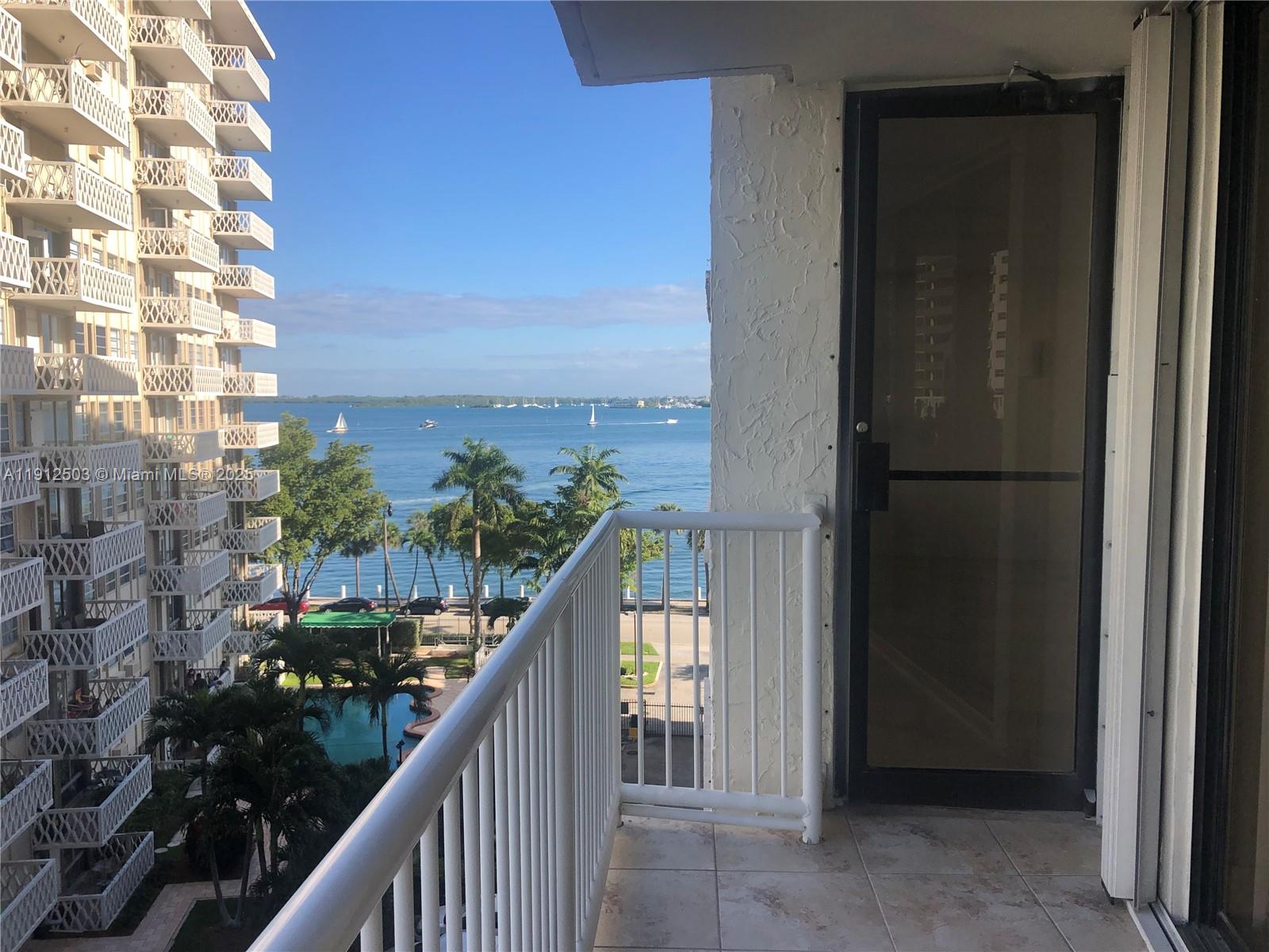 1440 Brickell Bay Drive, Unit 709 Miami, FL 33131 - Photo 1 of 13 a view of balcony with a potted plant