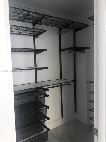 a view of a room with shelf on the wall