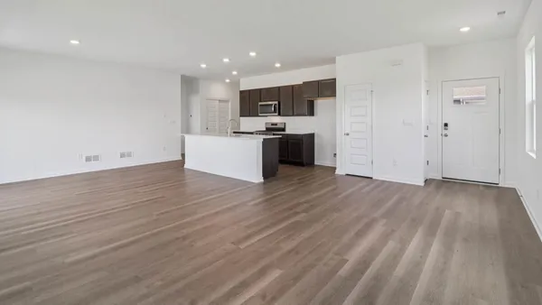 a view of kitchen with wooden floor