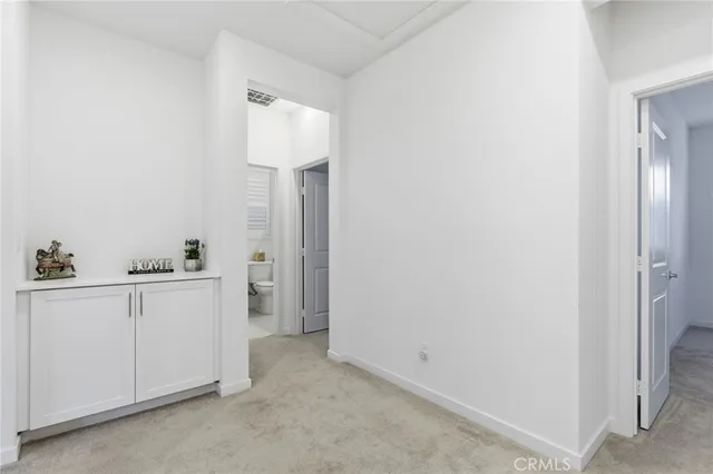 a bedroom with a bed and a ceiling fan