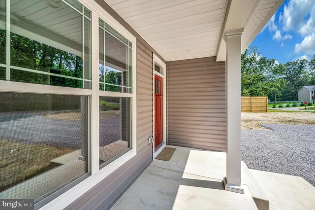 a view of a door and a window