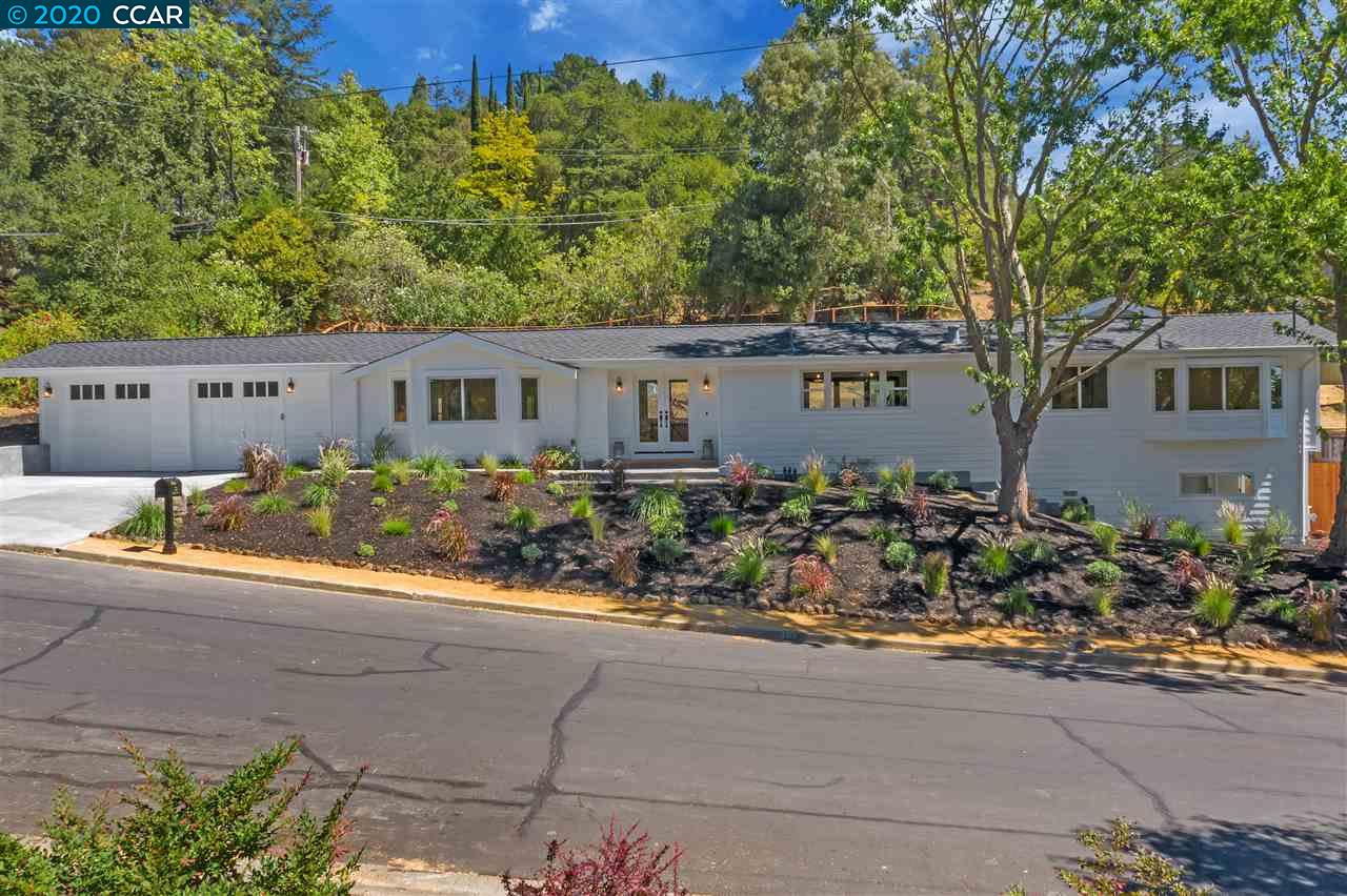 front view of a house with potted plants