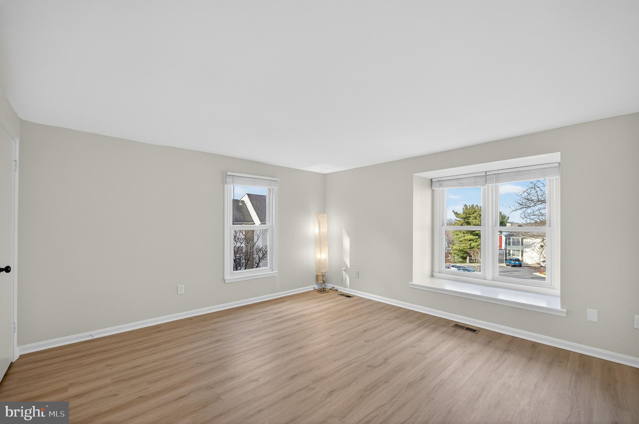 11920 Redtree Way Reston, VA 20194 - Photo 13 of 42 an empty room with wooden floor and windows