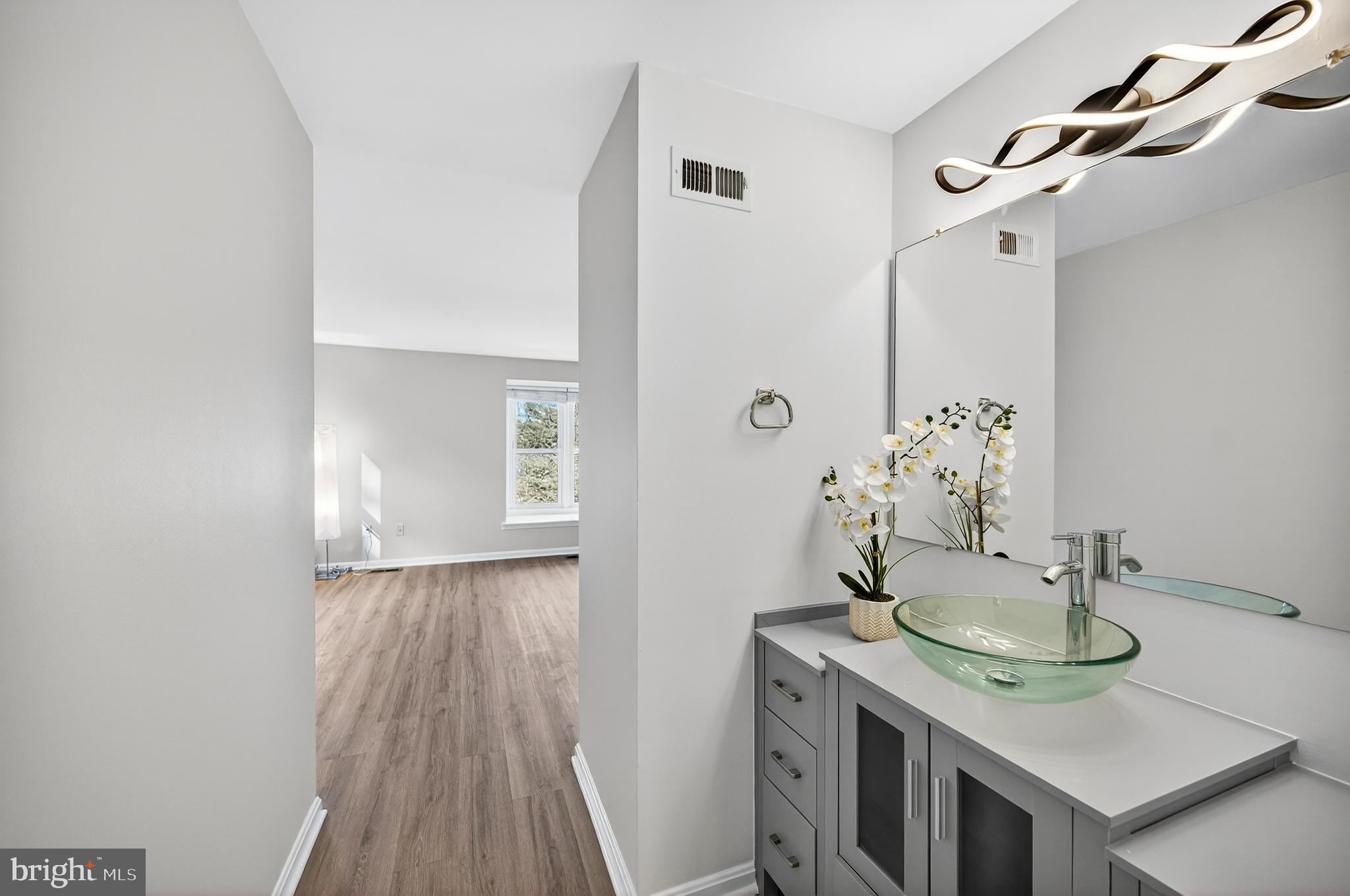 11920 Redtree Way Reston, VA 20194 - Photo 15 of 42 a bathroom with a sink and mirror