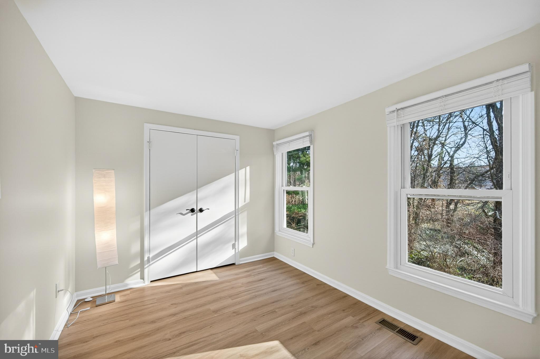 11920 Redtree Way Reston, VA 20194 - Photo 18 of 42 an empty room with windows and entrance