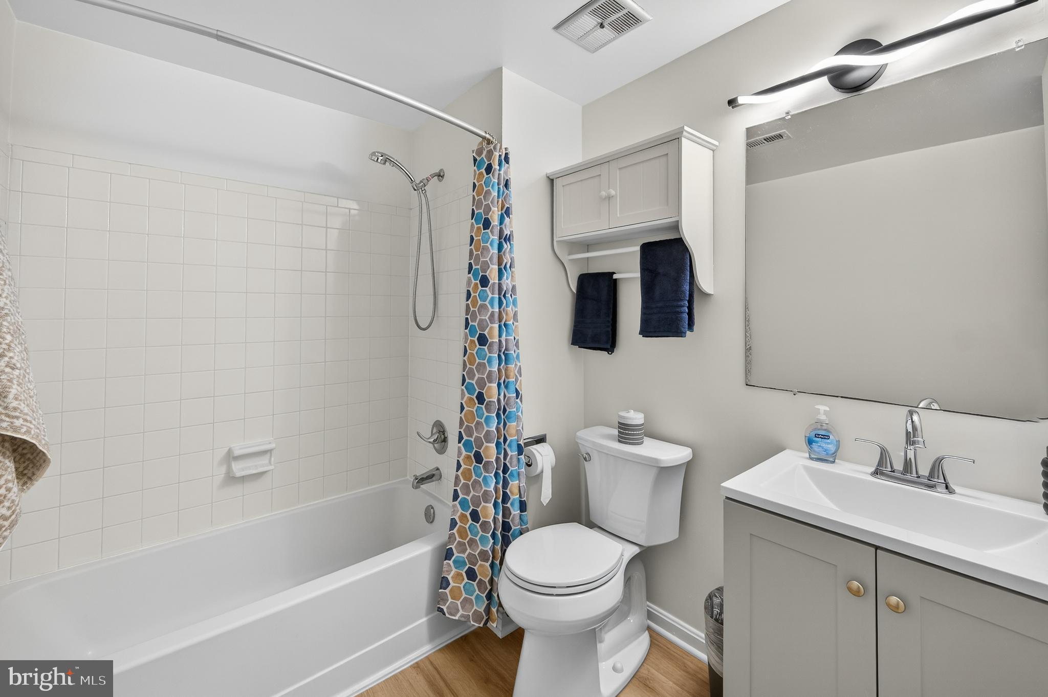 11920 Redtree Way Reston, VA 20194 - Photo 21 of 42 a bathroom with a sink toilet and shower