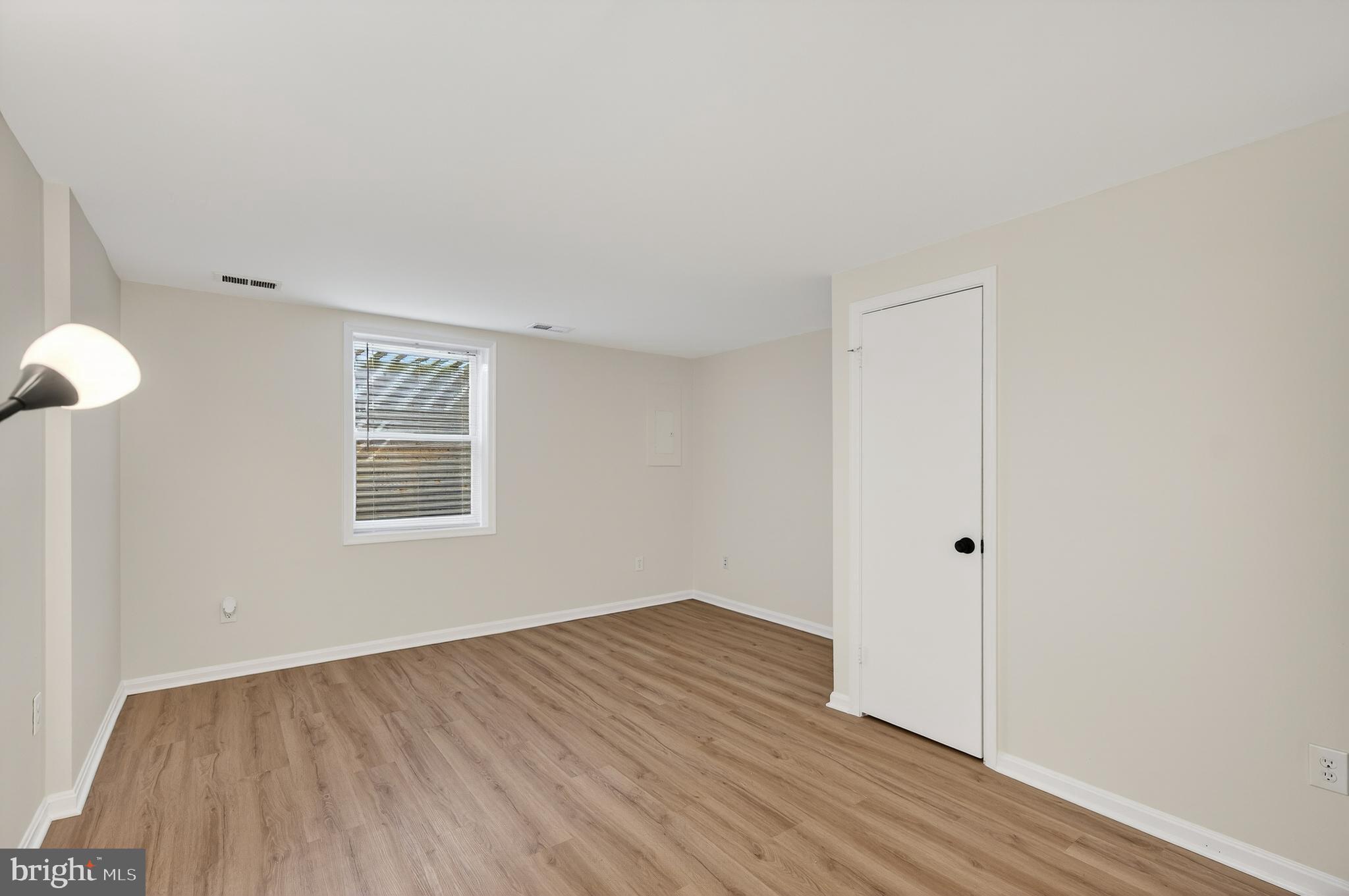 11920 Redtree Way Reston, VA 20194 - Photo 22 of 42 an empty room with wooden floor and windows