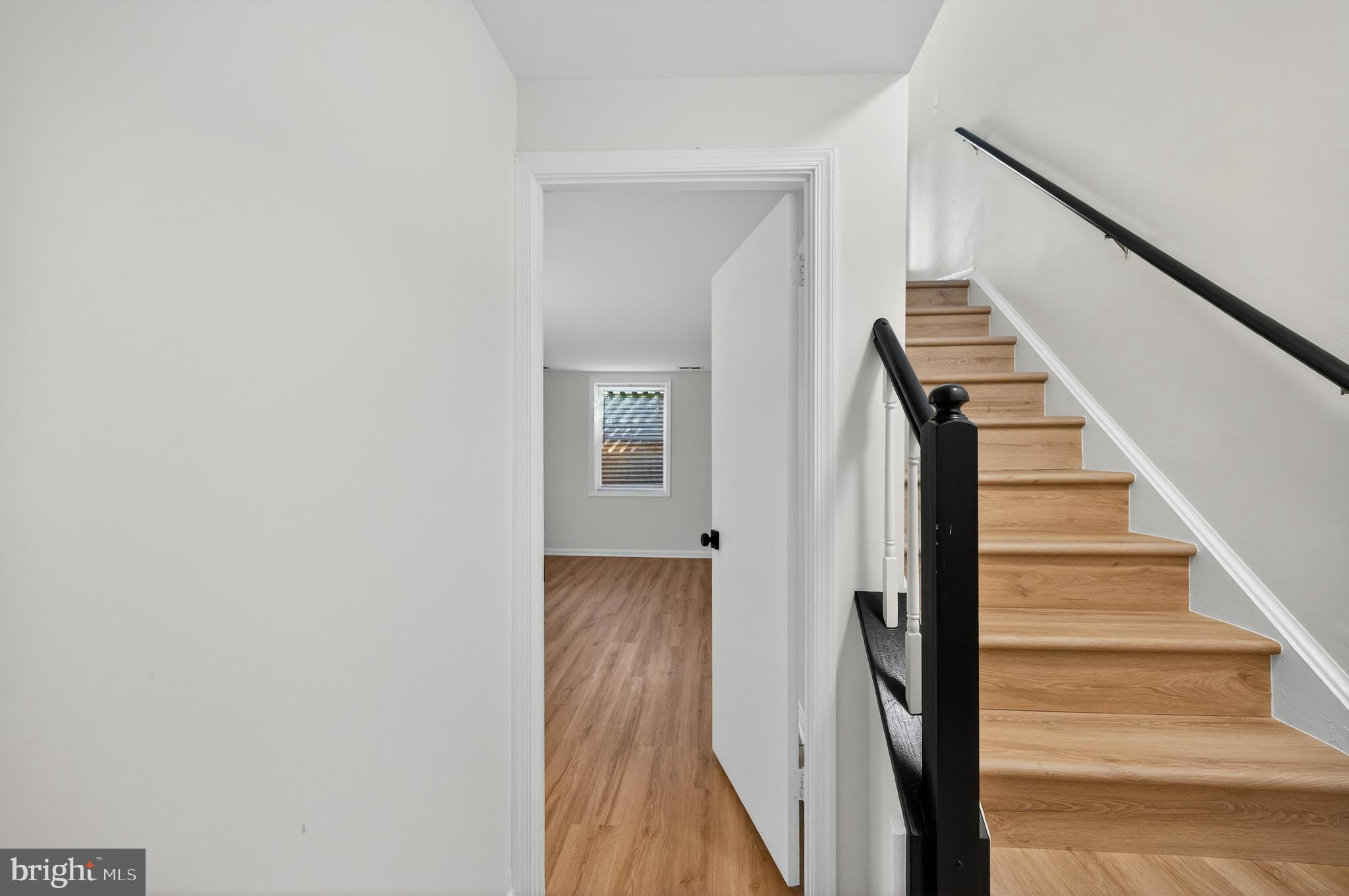11920 Redtree Way Reston, VA 20194 - Photo 24 of 42 a view of a hallway with wooden floor and entryway