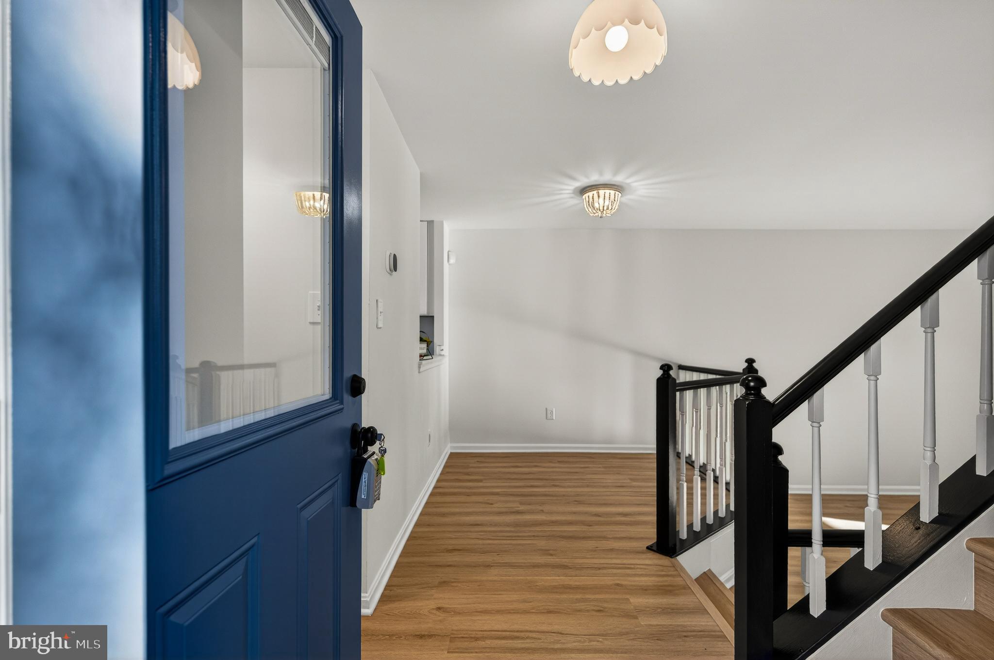 11920 Redtree Way Reston, VA 20194 - Photo 30 of 42 a view of a hallway with wooden floor and staircase
