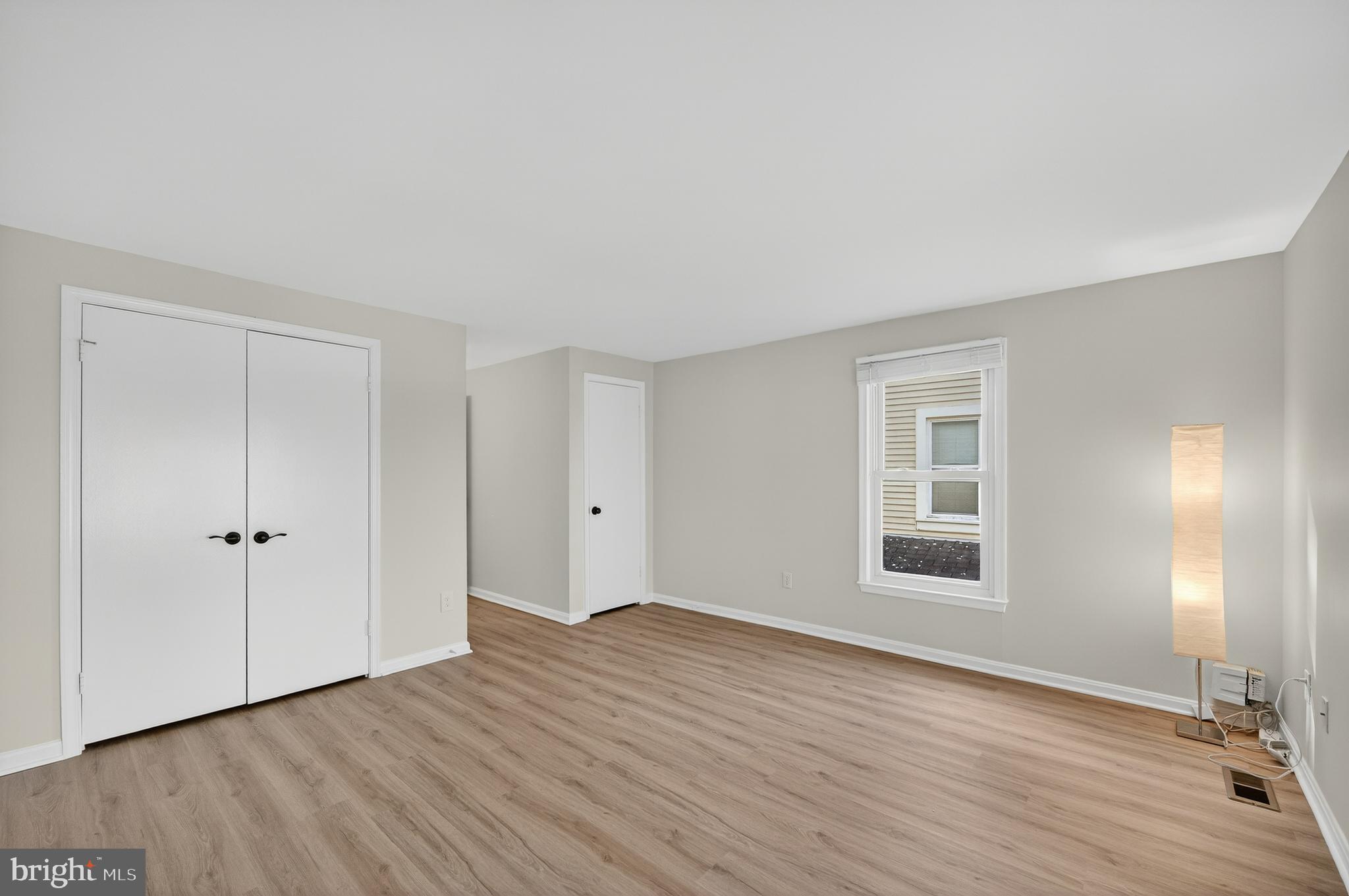 11920 Redtree Way Reston, VA 20194 - Photo 5 of 42 a view of an empty room with wooden floor and a window