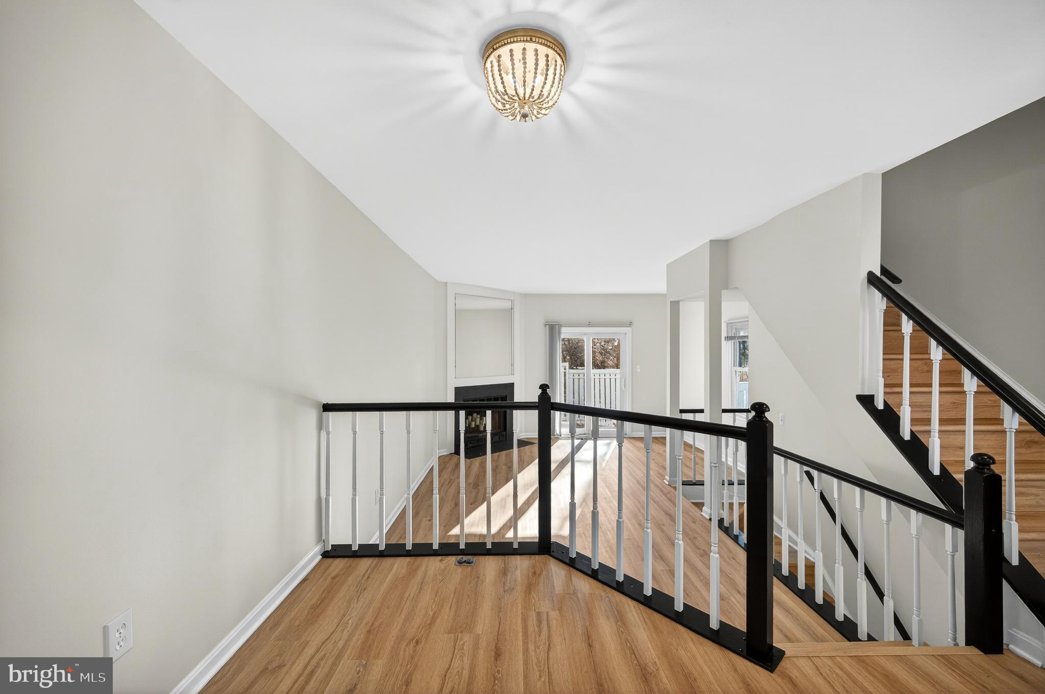 11920 Redtree Way Reston, VA 20194 - Photo 7 of 42 a view of staircase with wooden floor and a window
