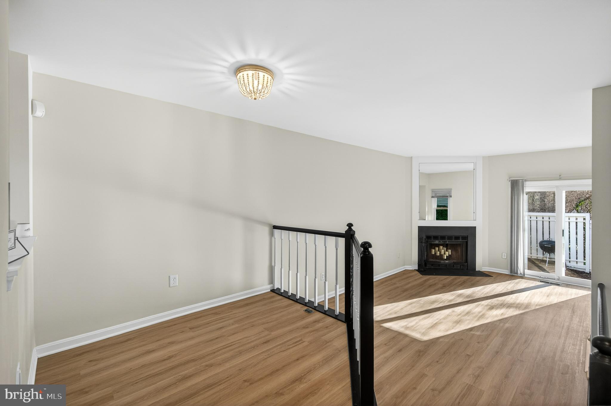 11920 Redtree Way Reston, VA 20194 - Photo 8 of 42 a view of a livingroom with wooden floor and staircase