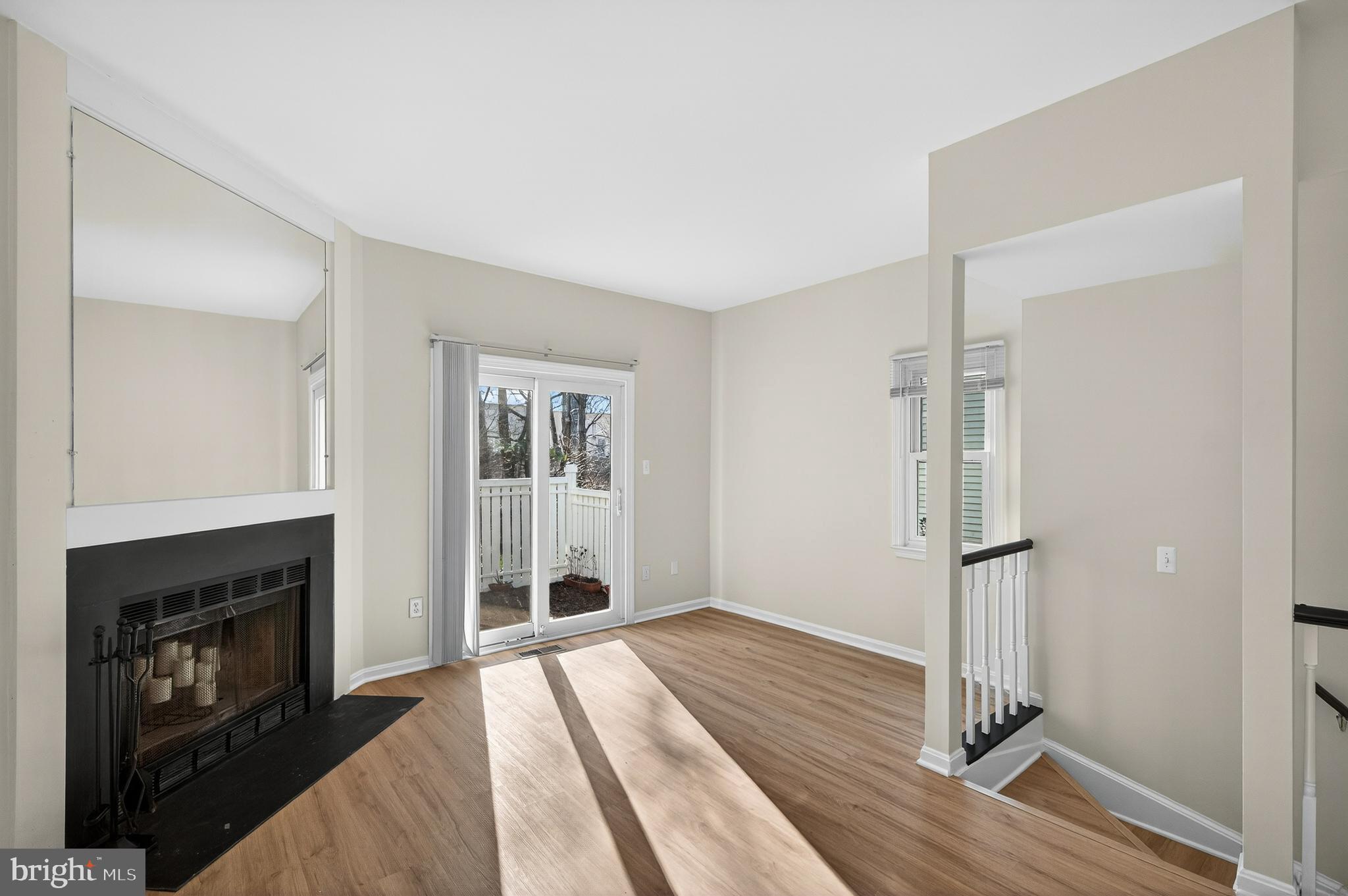 11920 Redtree Way Reston, VA 20194 - Photo 9 of 42 a view of empty room with wooden floor and fireplace