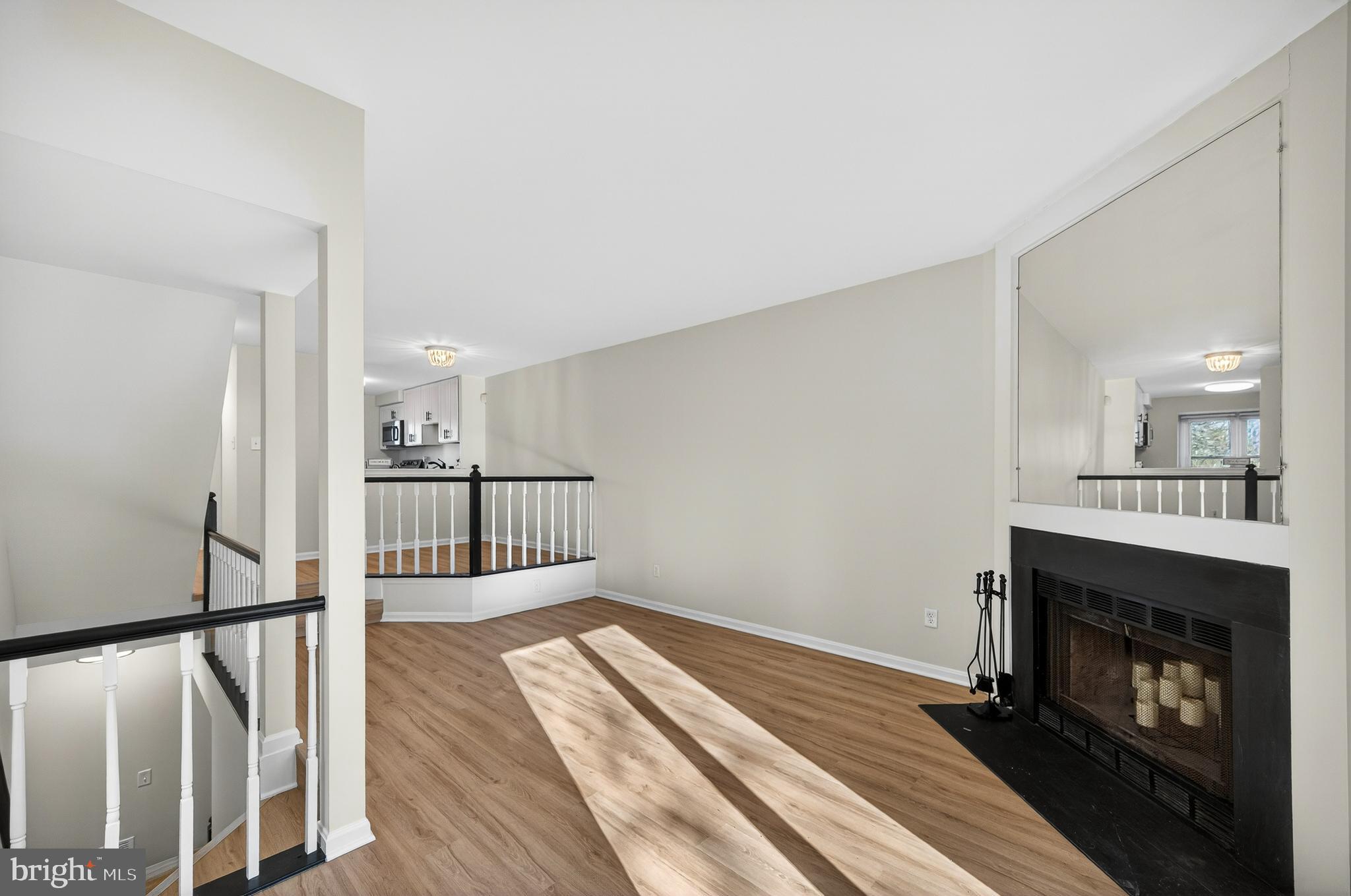 11920 Redtree Way Reston, VA 20194 - Photo 10 of 42 a view of a livingroom with wooden floor and a fireplace