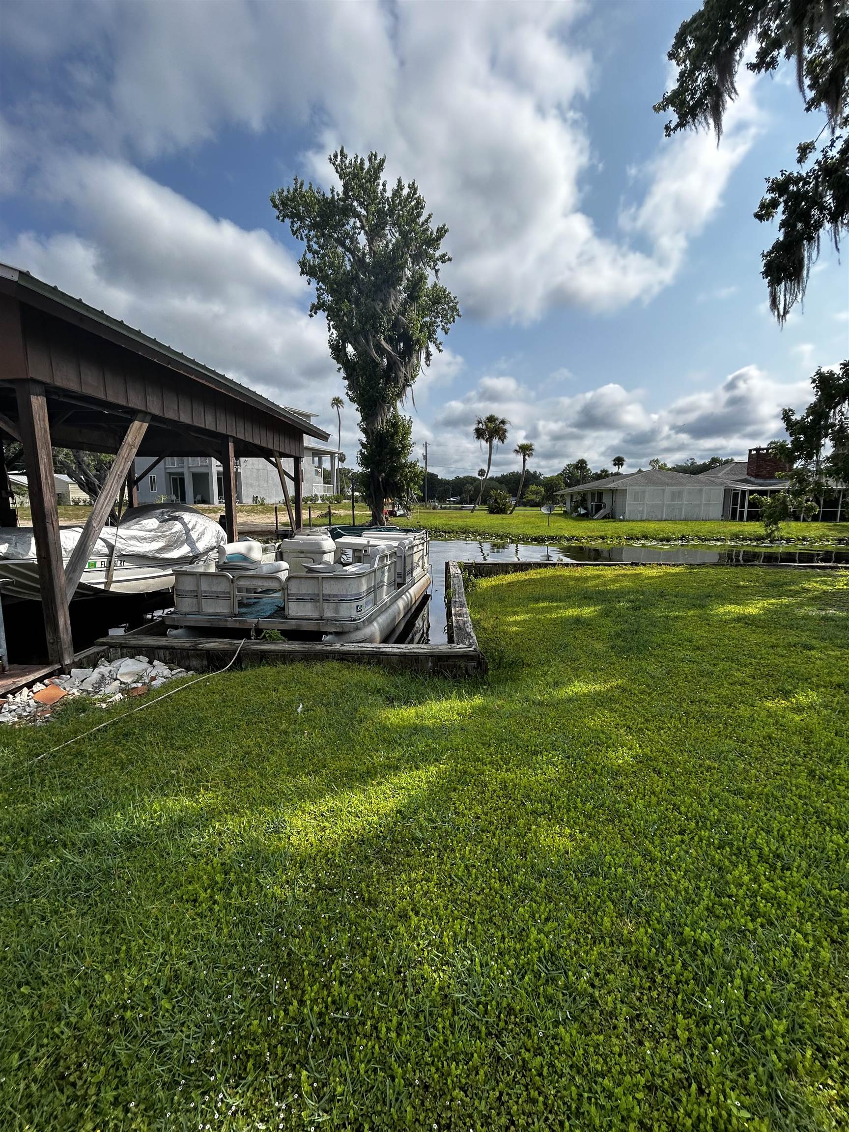 142 Hick's Avenue Crescent City, FL 32112 - Photo 14 of 16 a view of a house with a big yard