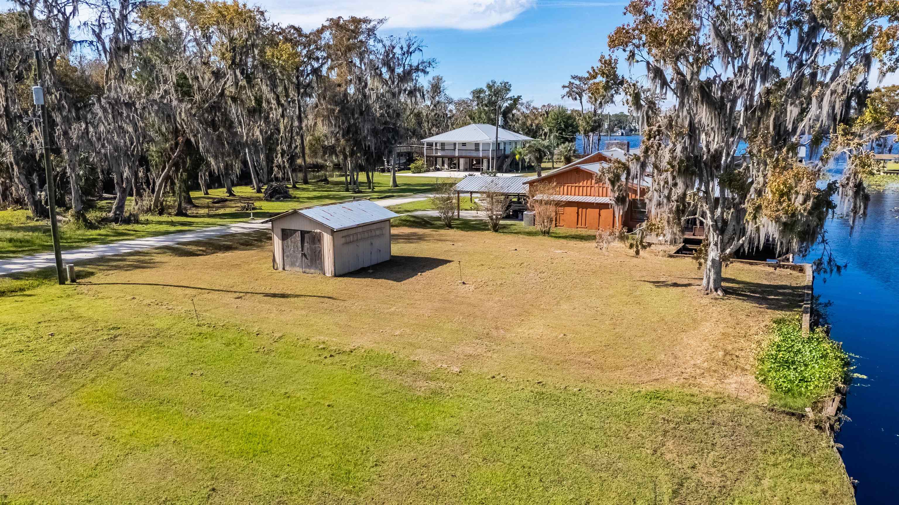 142 Hick's Avenue Crescent City, FL 32112 - Photo 6 of 16 a swimming pool with outdoor seating and yard
