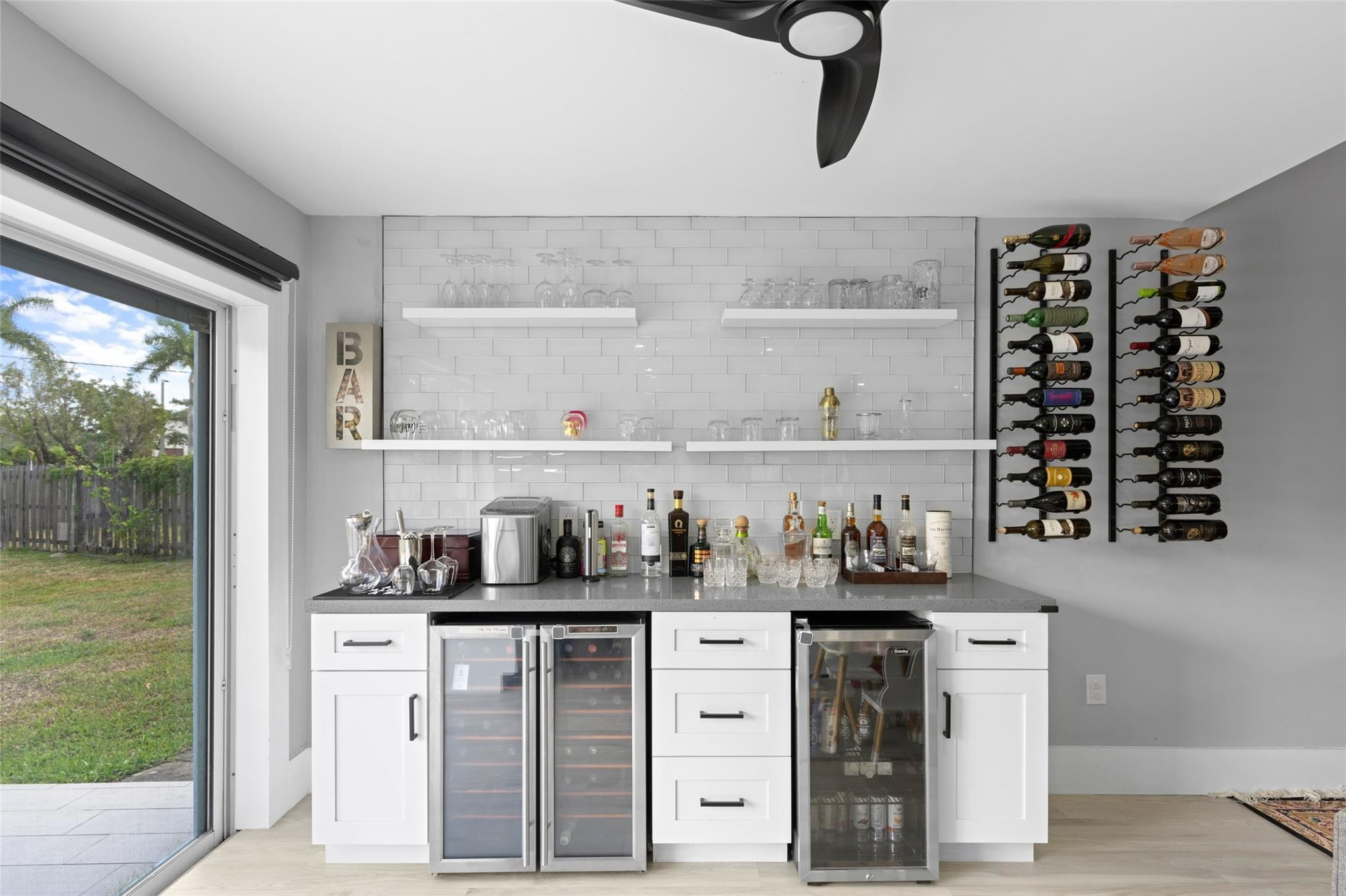 133 Southwest 159th Way Sunrise, FL 33326 - Photo 11 of 38 a kitchen with white cabinets and window