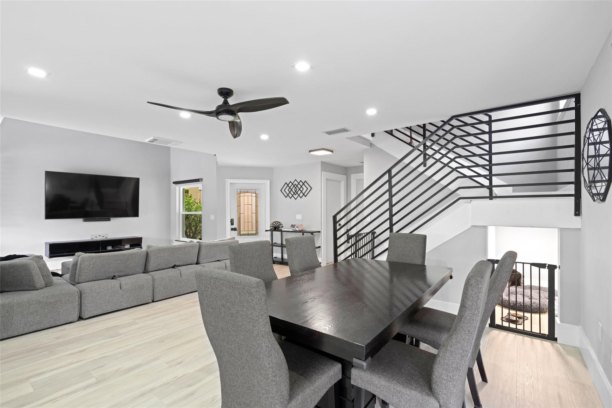 133 Southwest 159th Way Sunrise, FL 33326 - Photo 12 of 38 a living room with furniture kitchen view and a flat screen tv