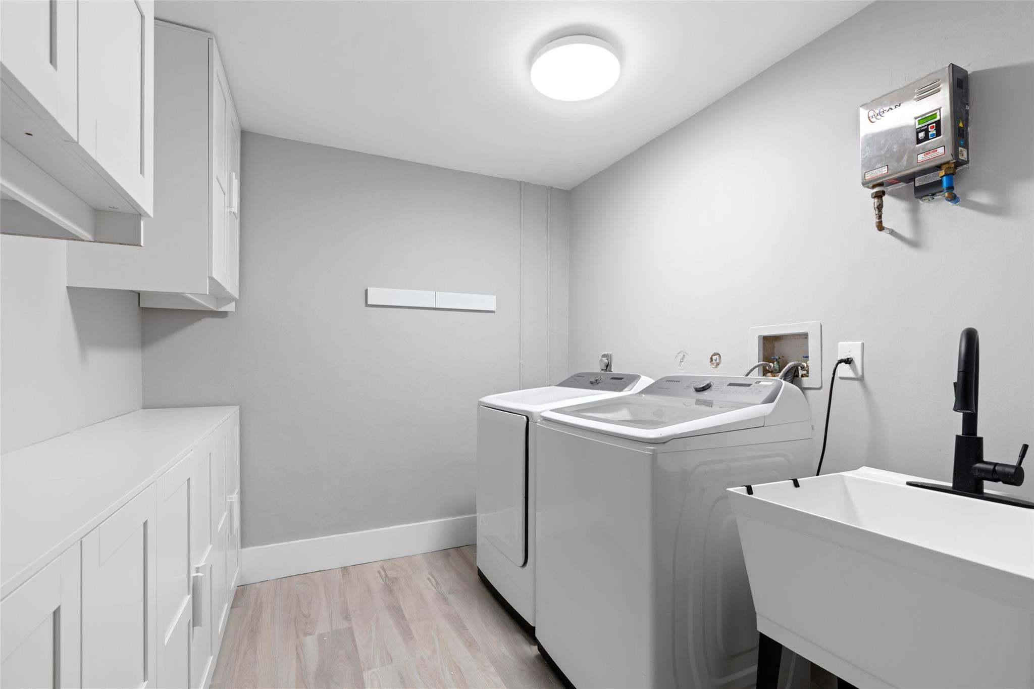 133 Southwest 159th Way Sunrise, FL 33326 - Photo 14 of 38 a utility room with dryer and washer