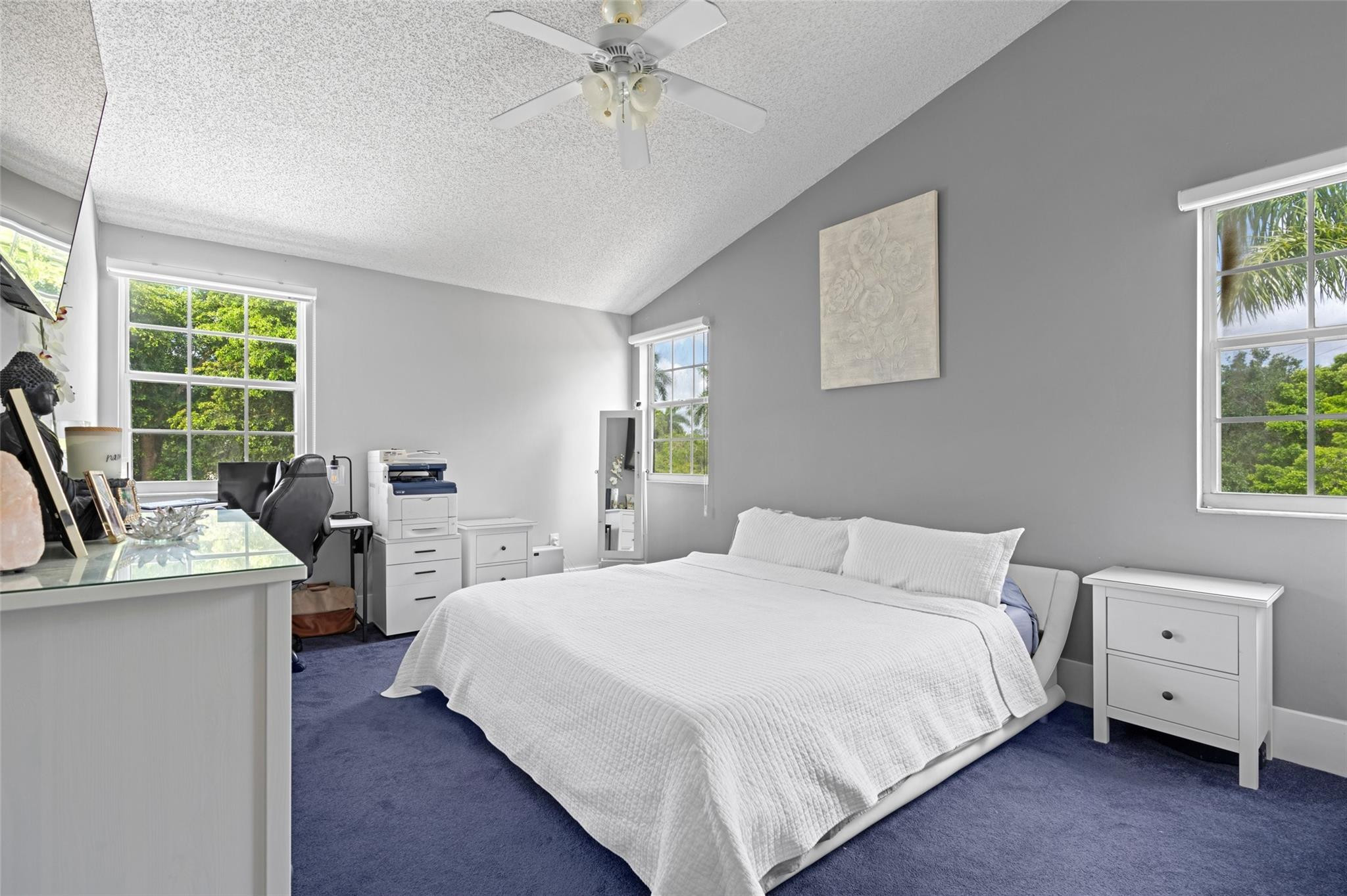 133 Southwest 159th Way Sunrise, FL 33326 - Photo 16 of 38 a bedroom with a bed and a chandelier