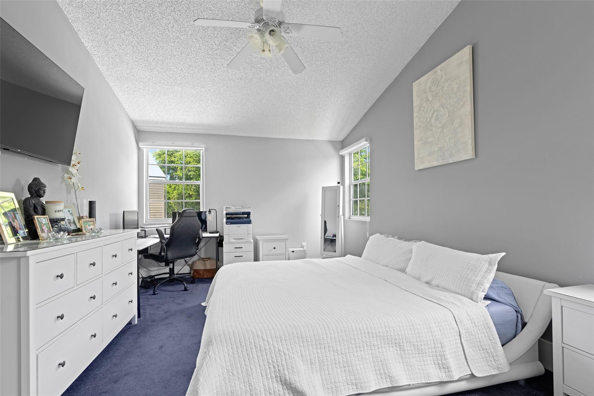 133 Southwest 159th Way Sunrise, FL 33326 - Photo 17 of 38 a bedroom with a bed and a dresser