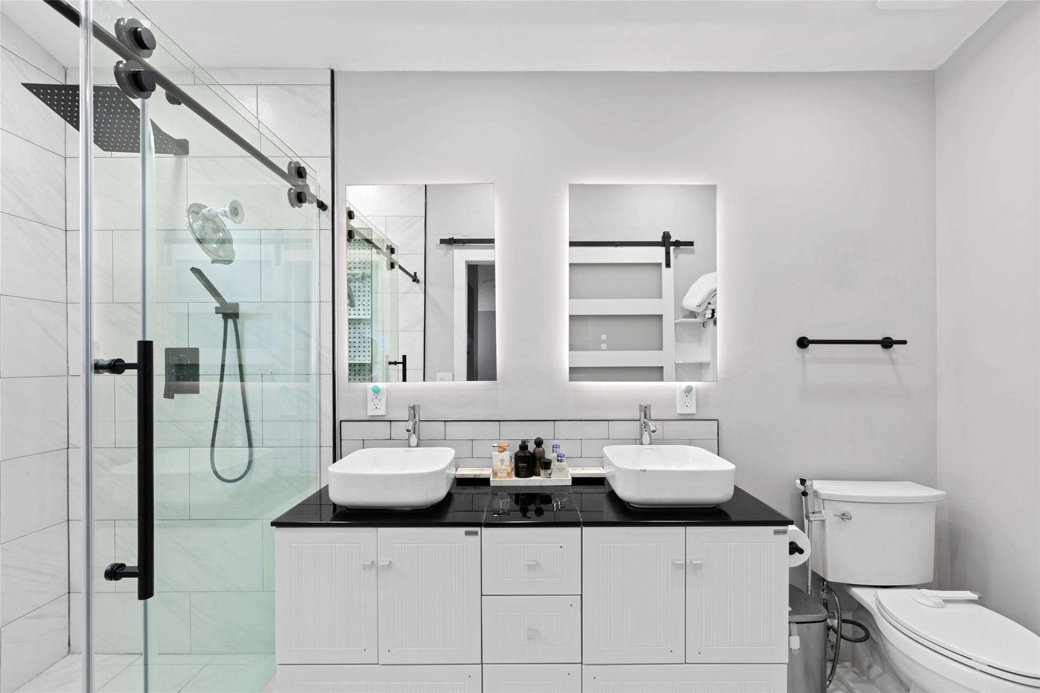 133 Southwest 159th Way Sunrise, FL 33326 - Photo 18 of 38 a bathroom with a sink and mirror with toilet